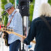 Rodney Mills, left, vocalist and guitarist for Resurrection Blues Band, performs during a Fridays by the Fountain concert in Howard Park on Friday, July 18, 2025, in South Bend. The band performs Aug. 29 at Round Barn Estate in Baroda as part of the Jammin' in the Vineyard Live Music Series' Labor Day Mega Weekend event.
