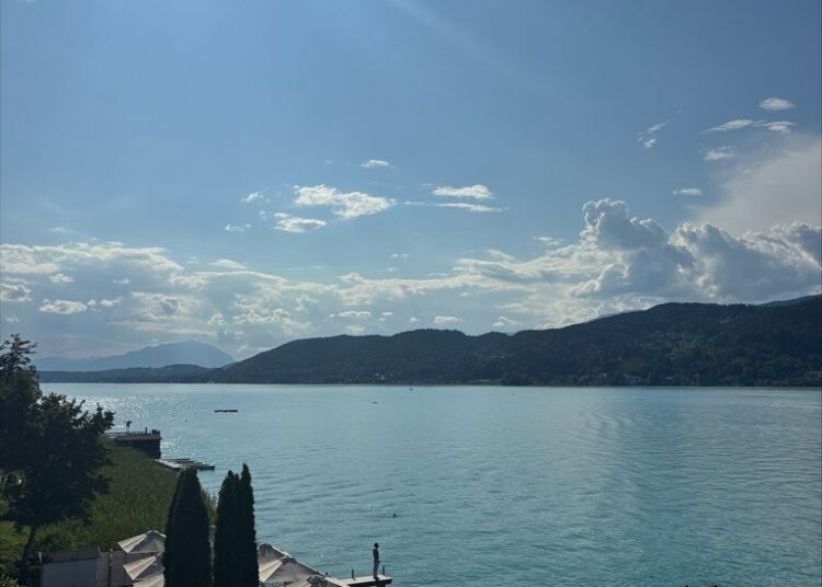 blue lake in austria with blue skies