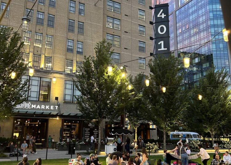 People gather on the lawn at Time Out Market for Movie Monday. (Simone Kronholm/Time Out Market)
