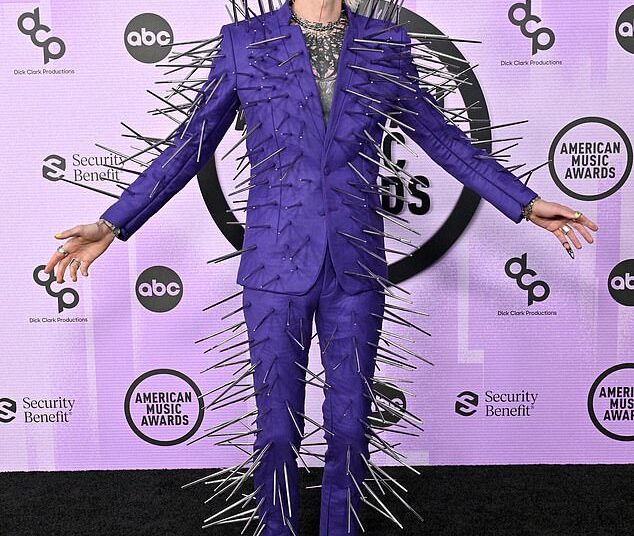 Over the years, some stars have attended the American Music Awards in fashion fails, and DailyMail.com rounded up the worst looks. Machine Gun Kelly is seen in 2022
