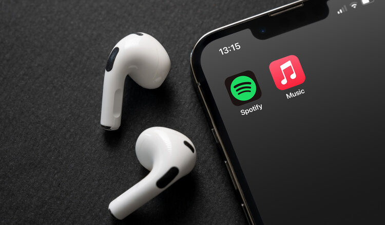 Apple Music and Spotify icons next to AirPods