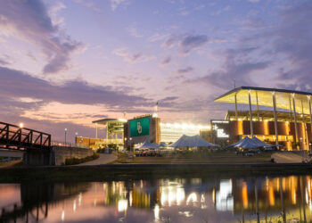 McLane Stadium exterior at sunset