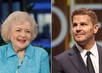 Betty White smiles wearing blue coat, David Boreanaz sports black suit.