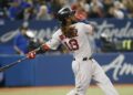 Boston Red Sox first baseman Hanley Ramirez (13) hits an RBI single against the Toronto Blue Jays in the sixth inning at Roge