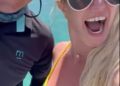 Britney Spears shows excitement as she dances to Justin Timberlake's song while on a yacht