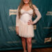 Brittany Cartwright at the Southern Charm Season 10 premiere party wearing a white dress and posing with her hand on her hip