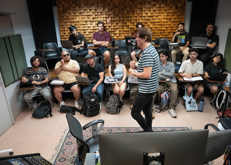 Evren Goknar talks with his students in his Digital Mastering, Editing and Delivery class MU 4280 class on the first day of classes