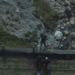 Aerial view of people working near a rocky stream.