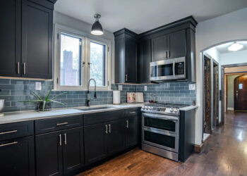 The updated kitchen at 14535 Ashton in Detroit's Rosedale Park neighborhood, featured in Steven Soderbergh's crime drama set in the 1950s "No Sudden Move," is listed for $350,000.