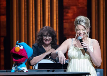 Sesame Street’s Elmo, performs with Lauren Alaina at Grand Ole Opry in Nashville, Tenn., Thursday, Aug. 14, 2025.
