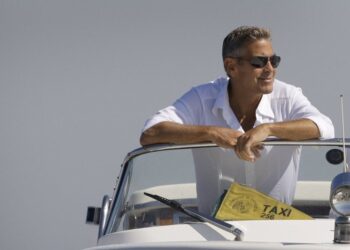 FILE - George Clooney arrives in Venice, Italy on a taxi boat for the 65th Venice Film Festival, Tuesday Aug. 26, 2008. (AP Photo/Joel Ryan, File)