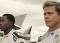 Damson Idris as Joshua Pearce and Brad Pitt as Sonny Hayes in Apple Original Films’ “F1 The Movie,” now in theaters and IMAX.
