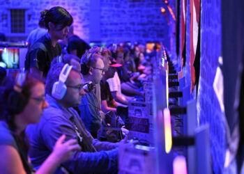 Gamers wait for the &ldquo;Crimson Desert&ldquo; video game of Pearl Abyss at the Gamescom video games trade fair at the Trade Fair Center in Cologne, western Germany, on Aug. 21, 2025. The 2025 edition of the vast Gamescom trade fair in Cologne, Germany, had its opening night on Aug. 19, 2025 and will be running from Aug. 20 to 24, 2025.