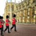 four royal guard marching outside palace
