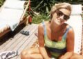 Princess Diana smiles while sunbathing on a lounger on the Caribbean island of Barbuda in 1996