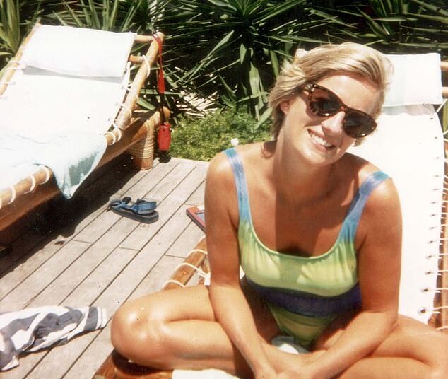 Princess Diana smiles while sunbathing on a lounger on the Caribbean island of Barbuda in 1996