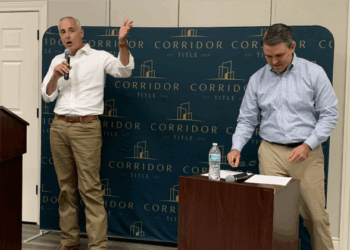 Mayor Josh Schroeder, left, had a conversation with Patrick Rose from Corridor Title about future development in the city, water and wastewater and road projects. (Photo by Kaitlyn Wilkes)