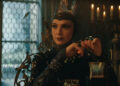 The Evil Queen (Gal Gadot) has dinner in Snow White.
