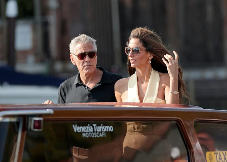 George Clooney and Amal Clooney are seen arriving in Venice ahead of the 82nd Venice International Film Festival.<p><a href="https://www.gettyimages.com/detail/news-photo/george-clooney-and-amal-clooney-are-seen-arriving-into-news-photo/2232204765" rel="nofollow noopener" target="_blank" data-ylk="slk:Jacopo Raule&sol;GC Images;elm:context_link;itc:0;sec:content-canvas" class="link ">Jacopo Raule&sol;GC Images</a></p>