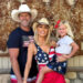 Gretchen Rossi and Slade Smiley post for a photo with their daughter