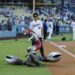 Ultraman takes down Alien Baltan before before the ceremonial first pitch on Tuesday night at Dodger Stadium.