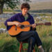 Chris Brain, the British folk singer-songwriter, plays his Sigma 12-fret acoustic in a rural setting.