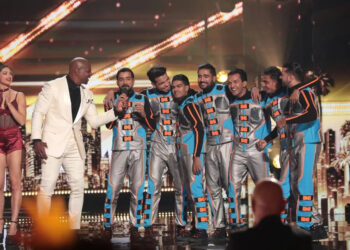 The Unreal Crew stands onstage with Terry Crews on AGT Episode 2013.