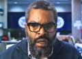 Ice Cube looking shocked at a computer screen.
