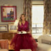 Sarah Jessica Parker as Carrie Bradshaw standing and holding a tray.