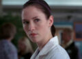 Lexie looking angry at Meredith after talking about her father.