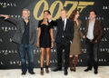 The cast of Skyfall in front of the iconic 007 logo - 2012