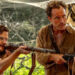 Daniel Bruhl and Jude Law pointing guns in Eden.