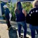 Mourners stand outside the home of actor Matthew Perry, Sunday, Oct. 29, 2023, in the Pacific Palisades area of Los Angeles. Perry, who starred as Chandler Bing in the hit series "Friends," has died. He was 54. (AP Photo/Eugene Garcia)