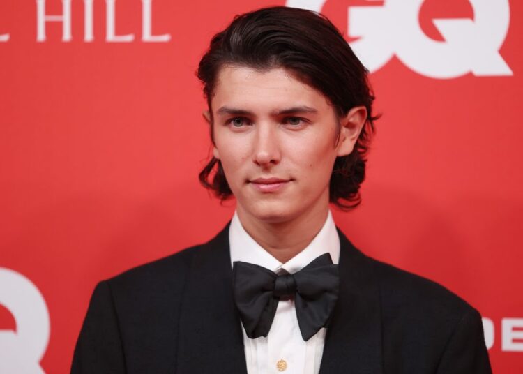 Count Nikolai in a black suit and bow tie