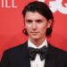 Count Nikolai in a black suit and bow tie