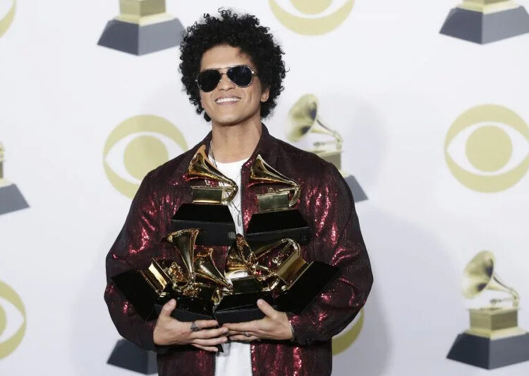 Bruno Mars arrives in the press room with his six Grammy Awards in 2018. File Photo by John Angelillo/UPI