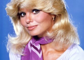 Loni Anderson in a white shirt.