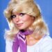 Loni Anderson in a white shirt.