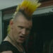 Matt Smith with a big orange and yellow punk mohawk as Russ in Caught Stealing.