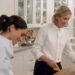 Meghan Markle and Clare Smyth working in a white kitchen and smiling