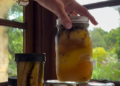 Meghan Markle holding a jar of preserved lemons