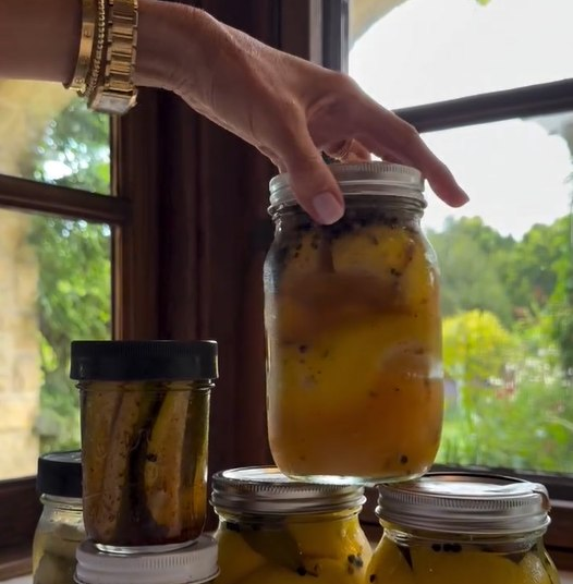 Meghan Markle holding a jar of preserved lemons
