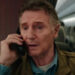 Liam Neeson sits on the phone in a plane in Cold Storage.