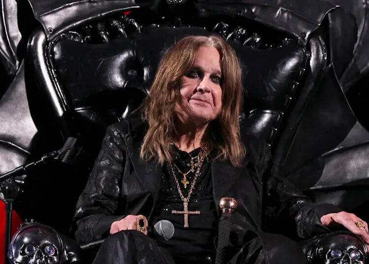 ozzy osbourne sitting in a black throne at his rock and roll hall of fame induction