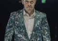 Perez Hilton in green suit
