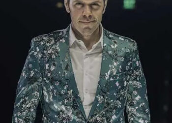 Perez Hilton in green suit