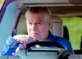 Prince Andrew pictured behind the wheel of a car