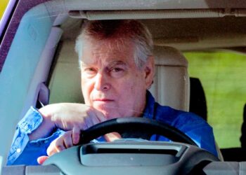 Prince Andrew pictured behind the wheel of a car