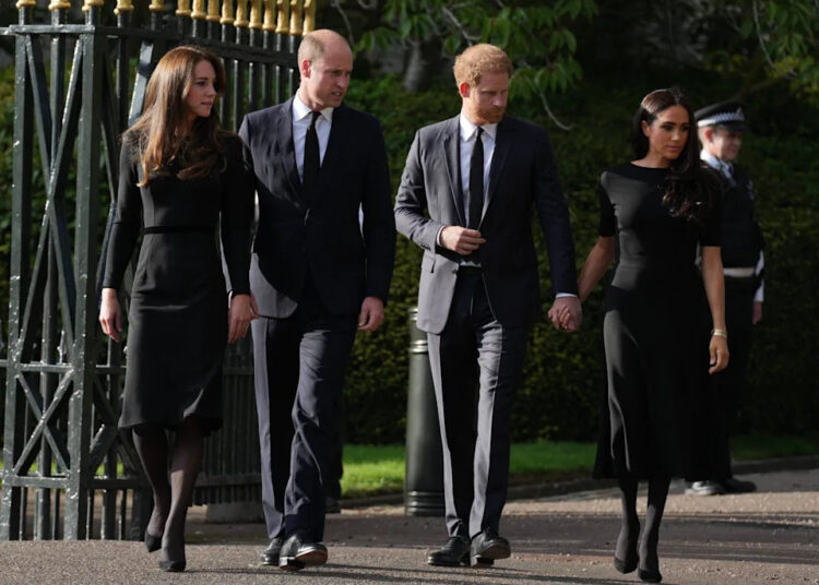 The Prince and Princess of Wales along with Prince Harry and Meghan Markle the Duke and Duchess of Sussex view the tributes at Windsor