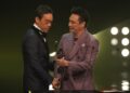Francis Ng (right) presents Lau Ching-wan with the best actor statue at the 41st Hong Kong Film Awards ceremony in April 2023. Photo: SCMP